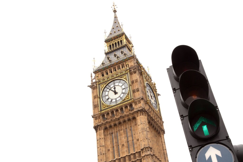 Companies House changes: image depicts Big Ben, London, set against a white background. In the foreground are a set of traffic lights on green.