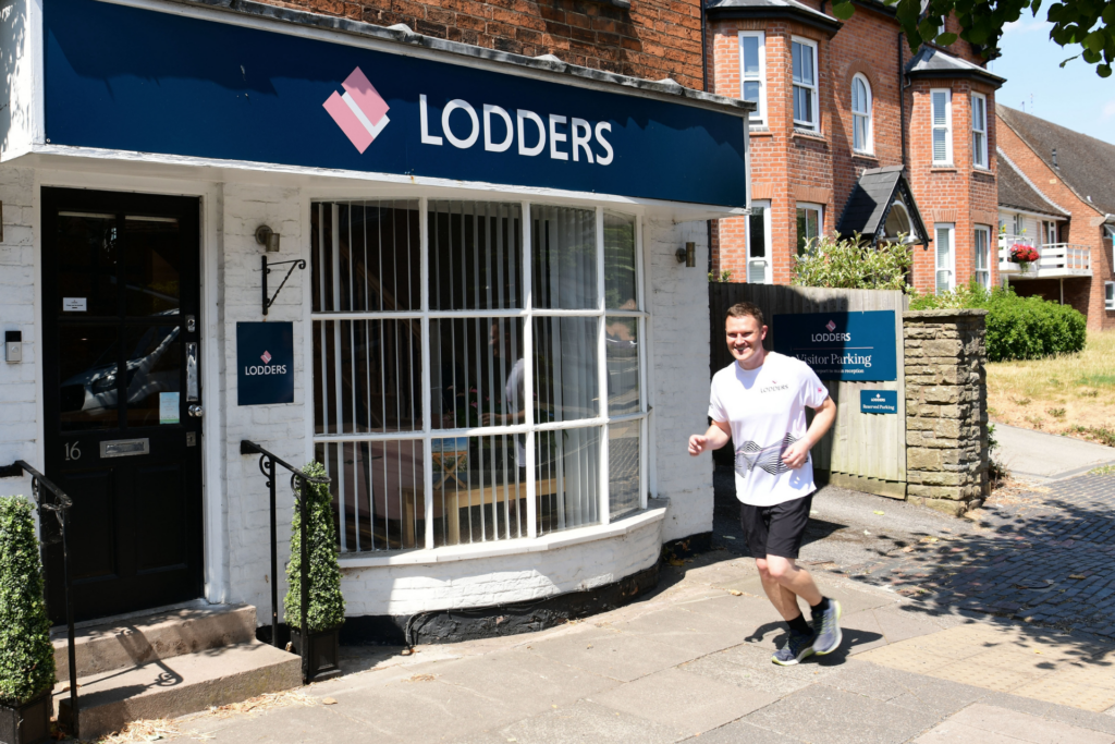 Stratford 10k - Dan MacLeod running outside Lodders office